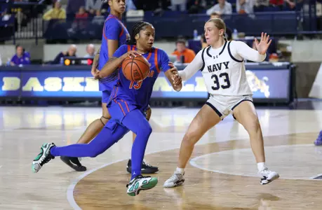 Laila Reynolds drives the lane against Navy