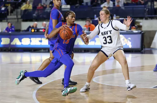 Laila Reynolds drives the lane against Navy