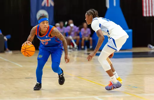 Liv McGill dribbles up the floor against a Memphis defender at the Grand Cayman Classic