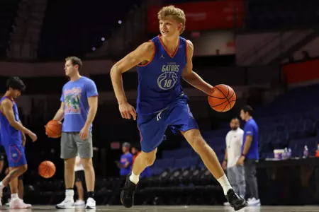 Thomas Haugh dribbles the ball at practice in the O'Dome