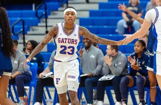 Liv McGill high fives Caterina Piatti following a basket against Georgia Tech in game two of the Cayman Islands Classic