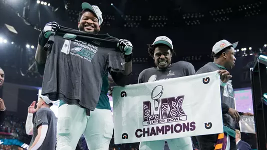 C.J. Gardner-Johnson and Fred Johnson celebrate after winning SB LIX