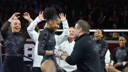 Skye Blakely celebrates her uneven bars routine at Oklahoma 250221