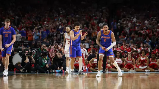 Clayton Jr claps and Richards yells in excitement on the court at the national championship