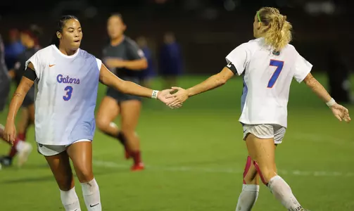 Kyra Taylor (left) and Zoe Main (#7) show support versus No. 5 Alabama 261008