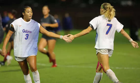 Kyra Taylor (left) and Zoe Main (#7) show support versus No. 5 Alabama 261008