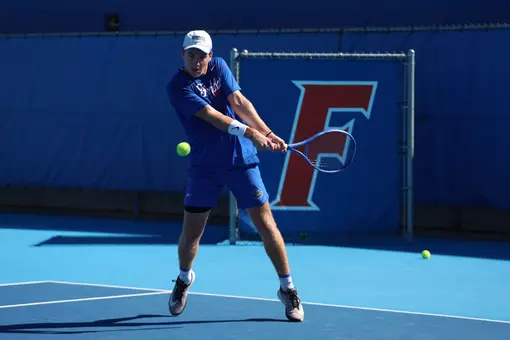 Ty Host Swings Racket at Practice