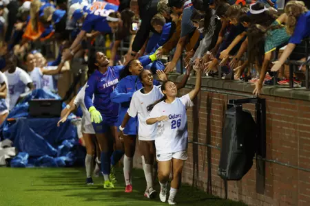 Florida's Iori Watanabe (#26), Adia Symmonds, Breahn Fisher, Jayden Emmanuel greet fans following 261008 win versus No. 5 Alabama