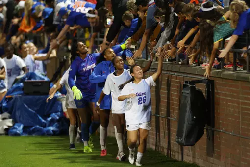 Florida's Iori Watanabe (#26), Adia Symmonds, Breahn Fisher, Jayden Emmanuel greet fans following 261008 win versus No. 5 Alabama
