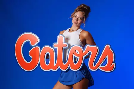 Women's Tennis Player Scarlett Nicholson poses at media day with the script Gators logo