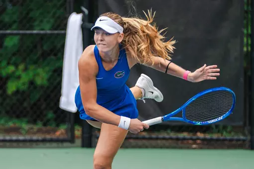 Women's Tennis Player Allegra Korpanec Davies follows through on a serve at the ITA All-American Championships