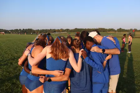 Women's Cross Country Huddle before John McNichols Invitational