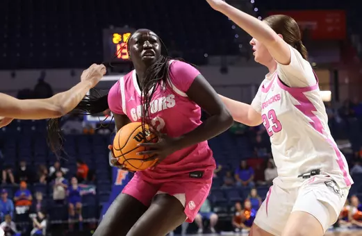 Nyadieng Yeitch drives the lane against Arkansas