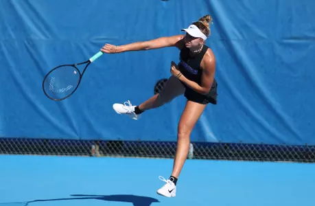 Lucia Pawlak serving against Troy