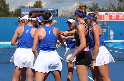 The Gators huddle up prior to the start of their match against Auburn