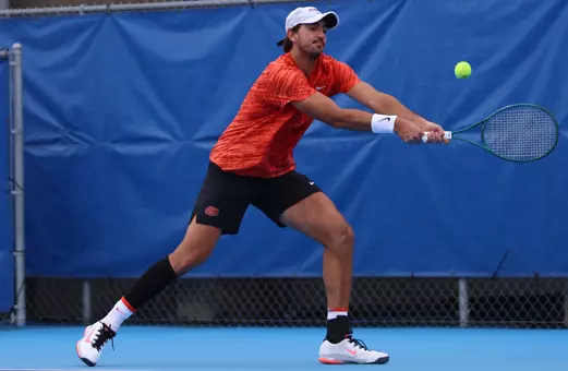 Lorenzo Claverie hitting backhand in match.