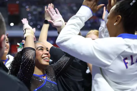 eMjae Frazier celebrates with teammates 260130