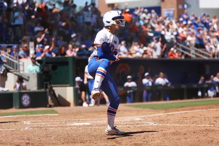 Gabi Comia celebrating after scoring a run against Tennessee