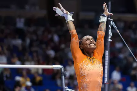 Selena Harris-Miranda salutes after her 10.0 uneven bars routine at the SEC Championships 260321