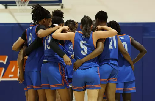The Women's Basketball Team huddles during a September practice