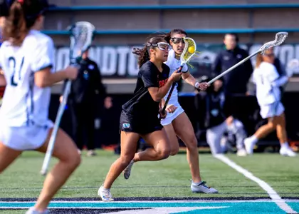 Autumn Blair with ball against Loyola