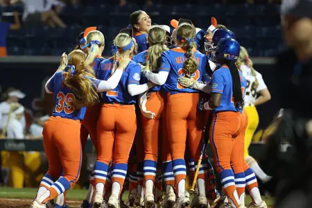 The Florida softball team celebrates a walk-off victory over Missouri.