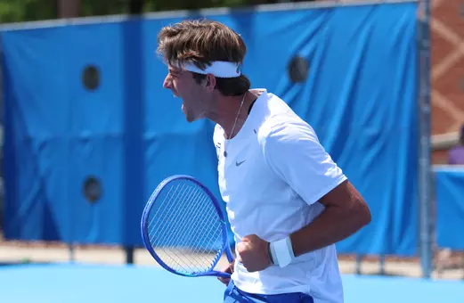 Pablo Perez Ramos screaming in celebration on court after earning a point in singles.