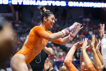 Kayla DiCello celebrates her uneven bars routine at the 2026 Southeastern Conference Championships 260321