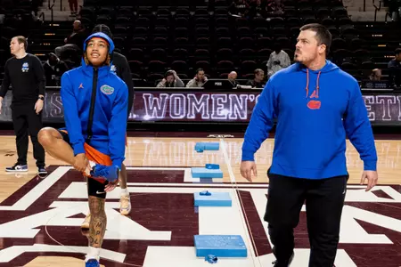 Athletic Performance Coach Jason Traylor works out the Women's Basketball Team pregame