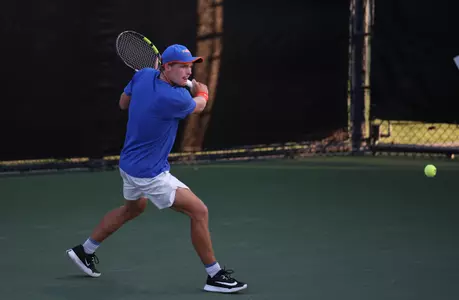 Kevin Edengren ready to hit backhand on court against Auburn in singles at the SEC Tournament.