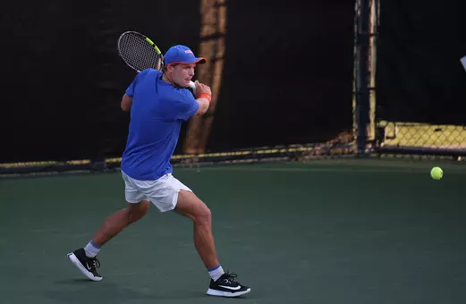 Kevin Edengren ready to hit backhand on court against Auburn in singles at the SEC Tournament.