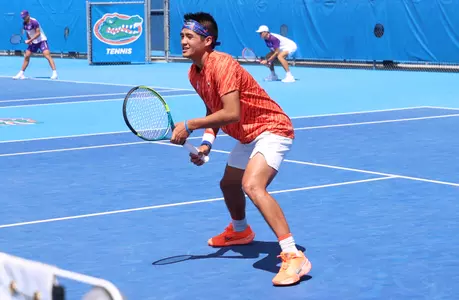 Tanapatt Nirundorn ready to volley at the net in doubles against the LSU Tigers on senior day.