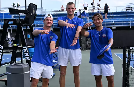Juniors Kevin Edengren (left), Henry Jefferson (middle), and Jeremy Jin (right) doing the Gator Chomp prior to the start of NCAA First Round against Stetson.