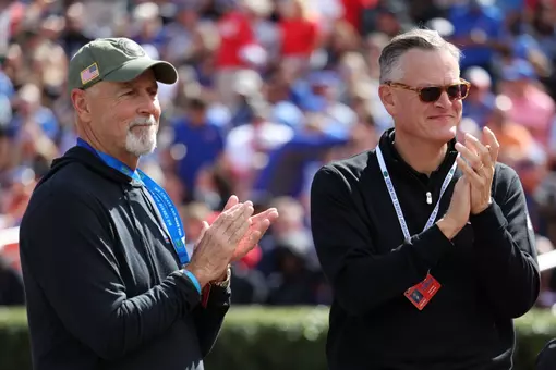 Phil Pharr and Scott Stricklin on the field during the Gators' game against the Arkansas Razorbacks on Saturday, November 4, 2023 at Ben Hill Griffin Stadium in Gainesville, Fla. / UAA Communications photo by Maddie Washburn
