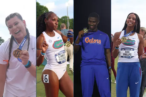 Four athletes for the Florida Gators show off their gold medals at Auburn's track.