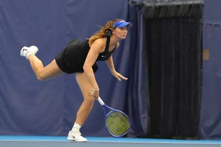 Brooke Black serving during warms up prior to the team's First Round NCAA match vs. Toledo