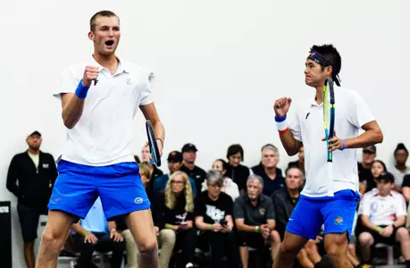 Henry Jefferson (left) and Tanapatt Nirundorn (right) celebrating a point in doubles on the court at the NCAA Second Round against UCF.