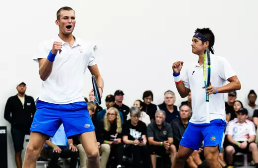 Henry Jefferson (left) and Tanapatt Nirundorn (right) celebrating a point in doubles on the court at the NCAA Second Round against UCF.