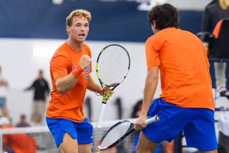 Kevin Edengren celebrates with teammate Andreas Timini at the indoor court.