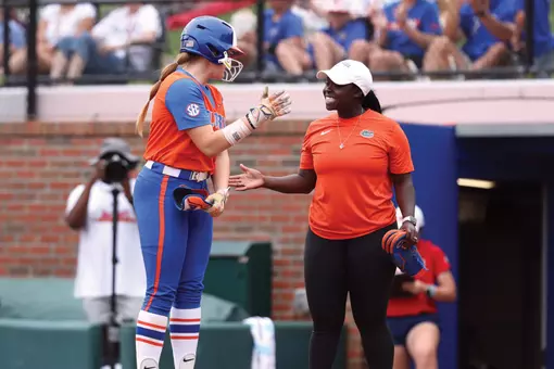 Charla Echols Thompson coaching first base during the 2024 season