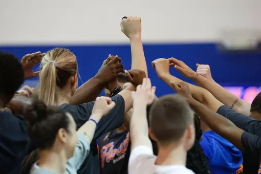 Women's Basketball Practice Hands Up In Huddle