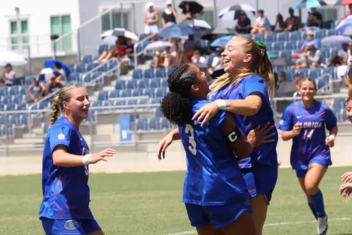 Addy Hess (right with green bow) celebrates her goal with Kyra Taylor at Florida Atlantic 260830