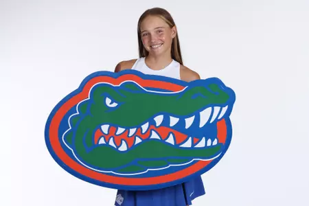 Women's Tennis player Nikola Daubnerova posed with a giant Gators logo at media day