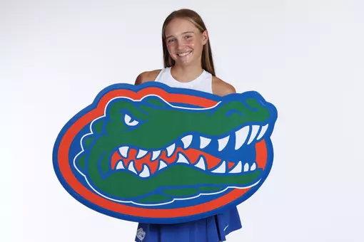 Women's Tennis player Nikola Daubnerova posed with a giant Gators logo at media day
