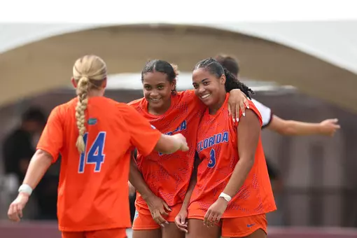 Lael Hill (center) celebrates her first collegiate goal with Tatum Borman (#14) and Kyra Taylor (#3) at Texas A&M 260927