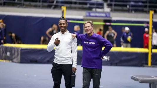 coach flood and erin posing together