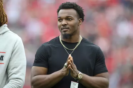 Former Georgia linebacker Nakobe Dean stands on the field after being presented a National Championship ring in the first half of Georgia's spring NCAA college football game, Saturday, April 16, 2022, in Athens, Ga. (AP Photo/Brett Davis)