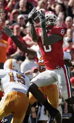 Georgia wide receiver A.J. Green (8) hauls in pass defended by Tennessee cornerbacks Janzen Jackson (15) and Art Evans in the first half. (AP Photo/John Amis)