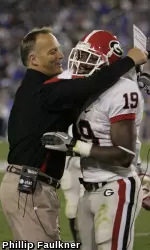 Georgia head coach Mark Richt celebrates with Sanders Commings after a fumble recovery. (Photo by Phillip Faulkner)