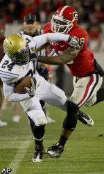 Georgia safety Bacarri Rambo (18) shoves Georgia Tech running back Embry Peeples (24) out of bounds during the first half of an NCAA college football game in Athens, Ga., Saturday, Nov. 27, 2010. (AP Photo/Rich Addicks)